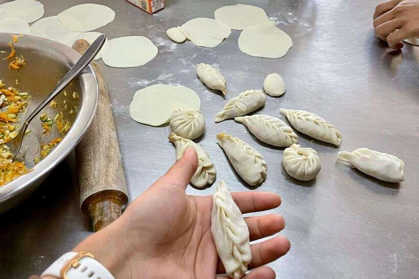 Kathmandu: Traditional Momo Making Class & Pickup - Starting with a local ingredient stop